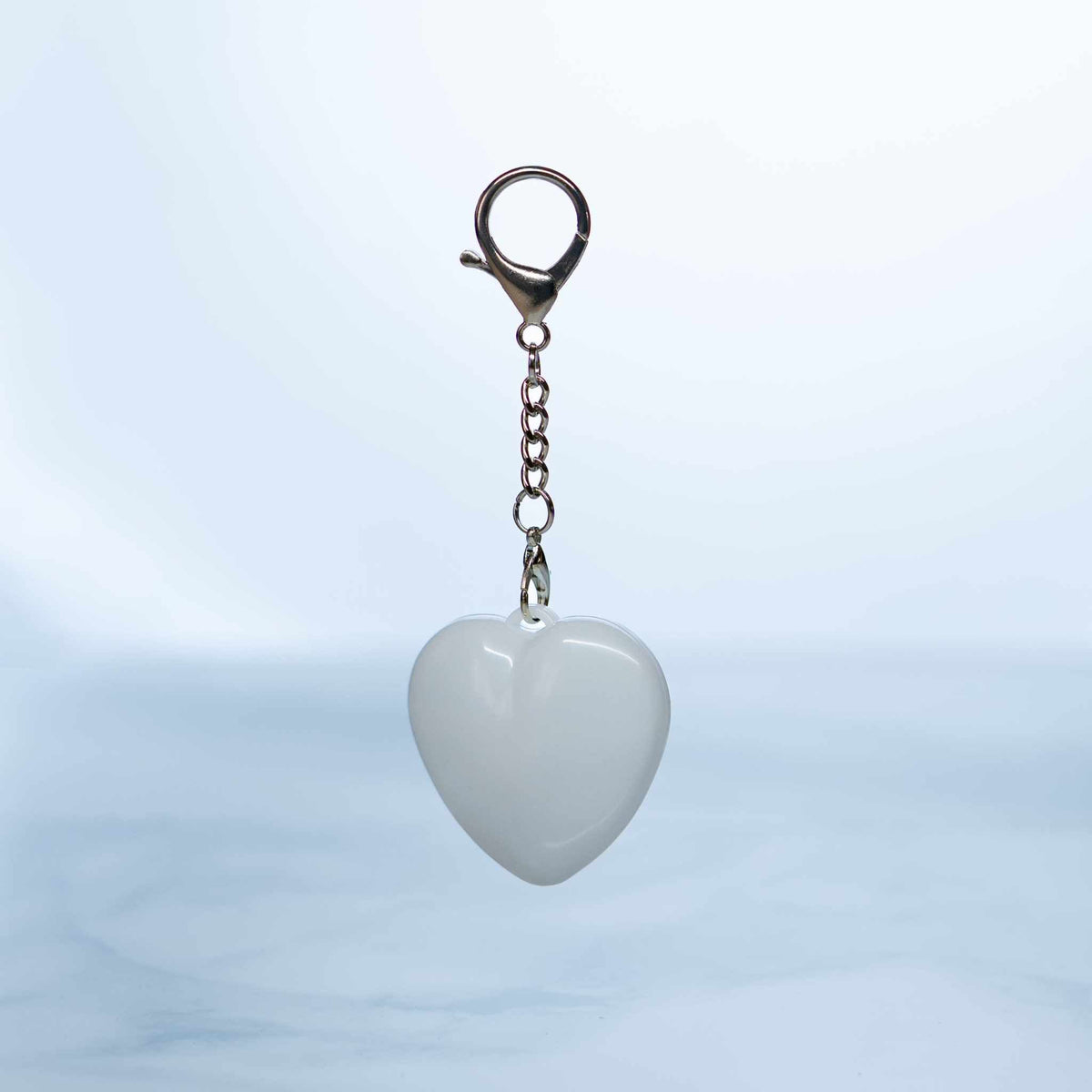 LumiHeart™ Motion Glow heart-shaped keychain light with motion-activated soft white LED glow and metal hook