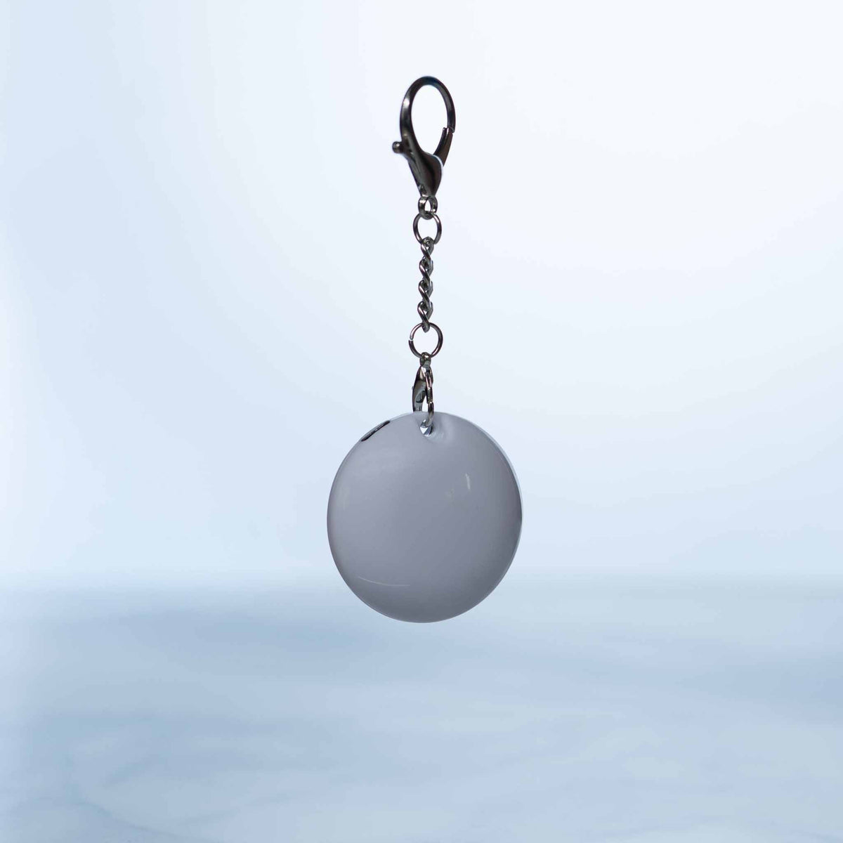 LumiHeart™ Motion Glow keychain light with motion-activated soft white LED and metal clip